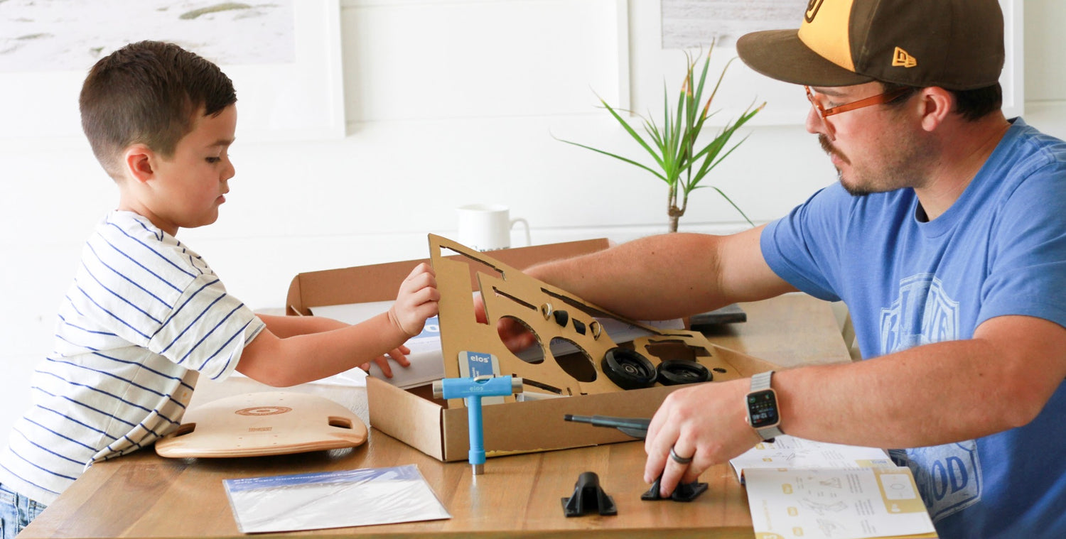 A father is having a great family time by assembling Elos DIY Kit with his son as a Sunday activity