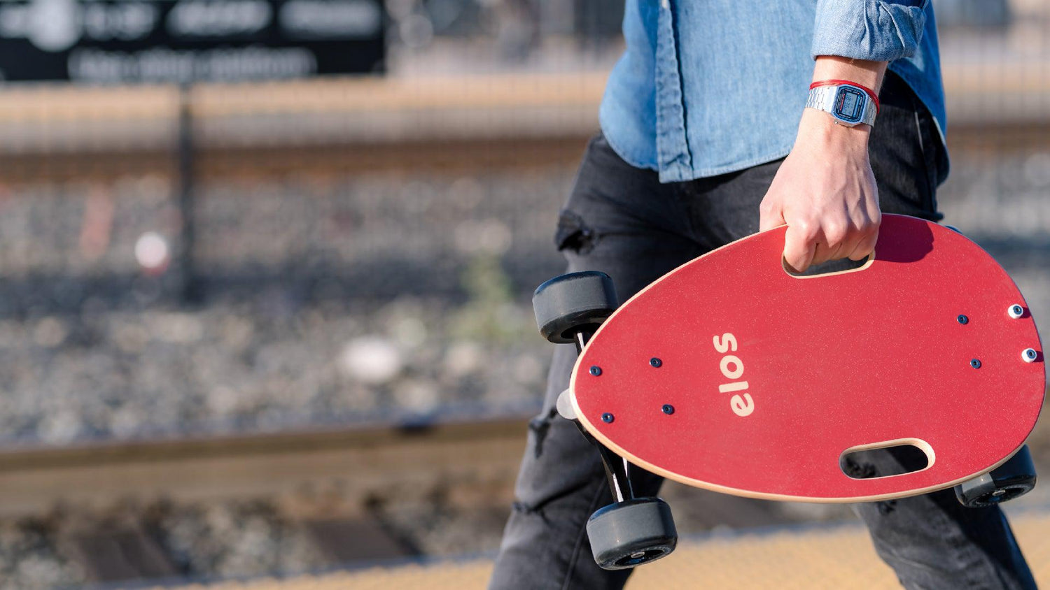 A man showcasing Elos, the best mini cruiser skateboards alongside other popular skateboards such as penny board and longboard.