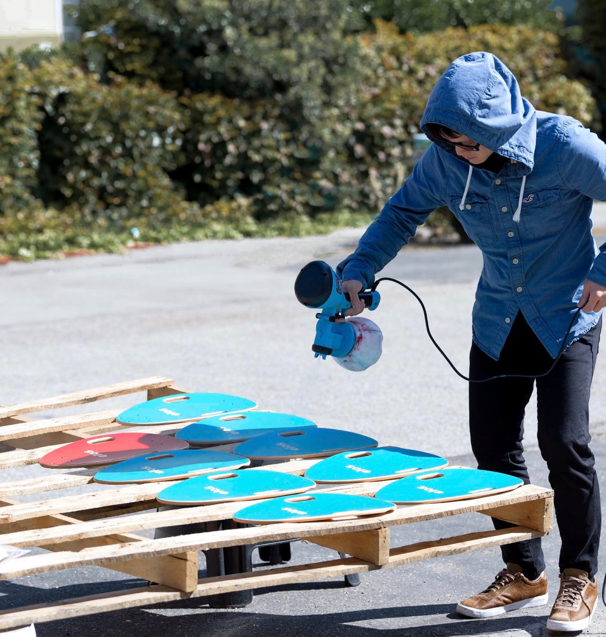 Elos founder Tom showing the process of making Elos skateboards