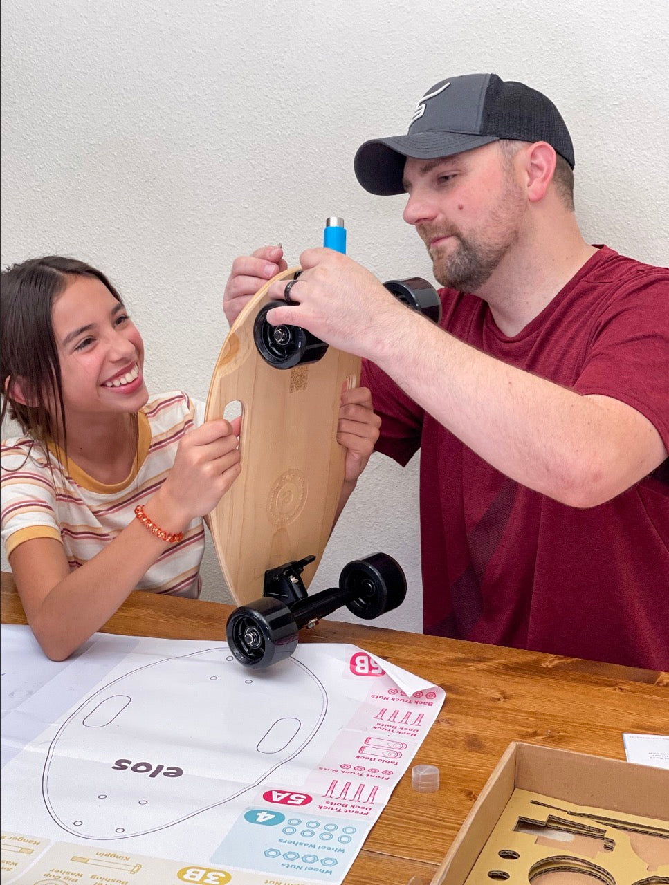 father and daughter bonding while assembling Elos DIY Kit for quality family time